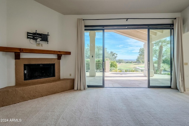 unfurnished living room featuring carpet flooring