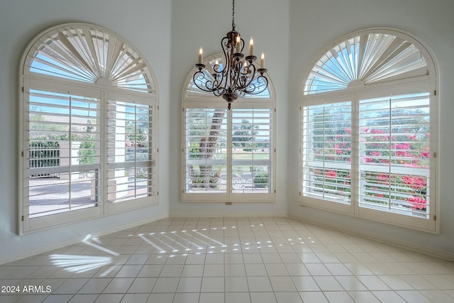 unfurnished dining area with a wealth of natural light and light tile patterned floors