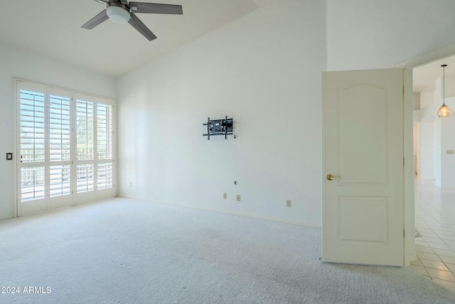 spare room featuring ceiling fan and light tile patterned flooring