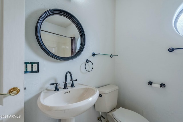 bathroom with sink and toilet