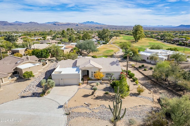 birds eye view of property with a mountain view