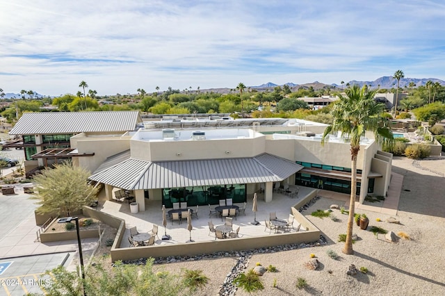 birds eye view of property featuring a mountain view