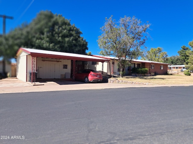 view of front of property with an attached carport