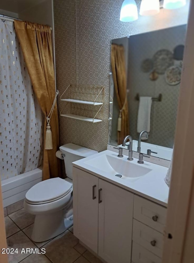bathroom with tile patterned flooring, shower / tub combo with curtain, toilet, and vanity