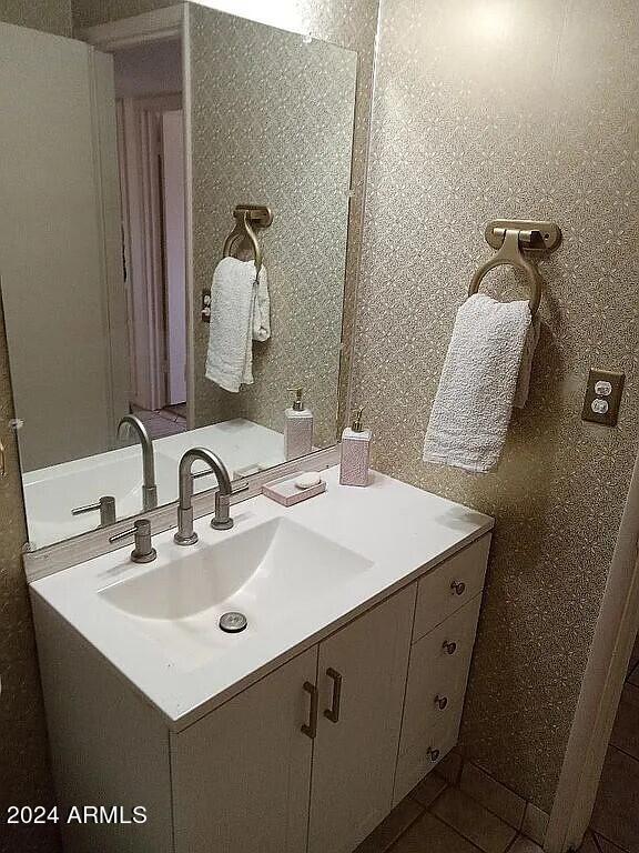 bathroom with tile patterned floors and vanity