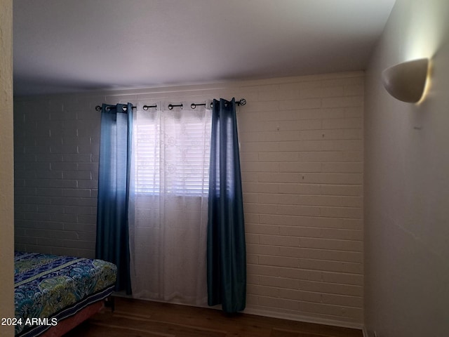 bedroom with wood finished floors