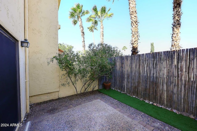 view of patio featuring fence