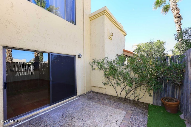 view of patio / terrace featuring fence