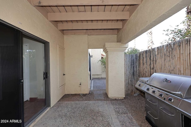 view of patio featuring fence