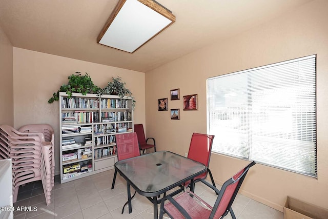 office area with tile patterned flooring and baseboards