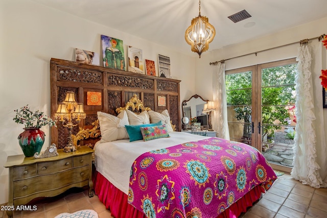 bedroom with access to outside, a notable chandelier, and light tile patterned flooring