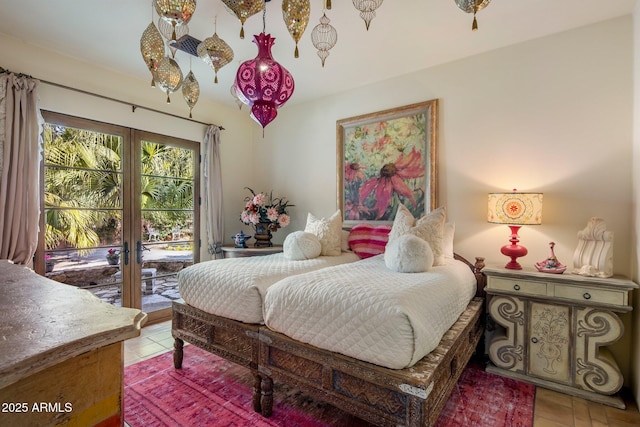 tiled bedroom featuring access to outside and french doors