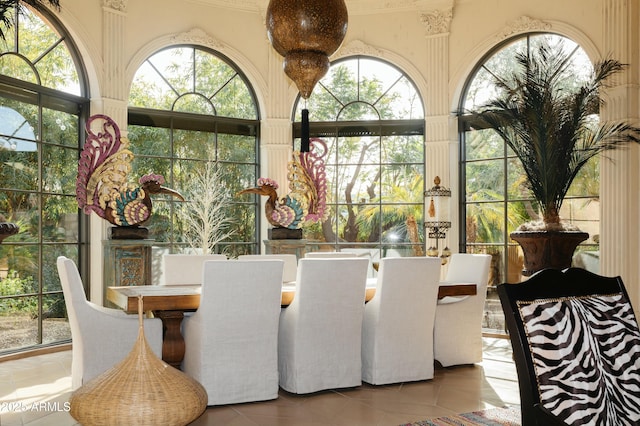 tiled dining room with plenty of natural light