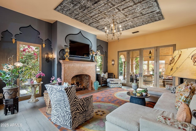 living room featuring a chandelier and hardwood / wood-style flooring