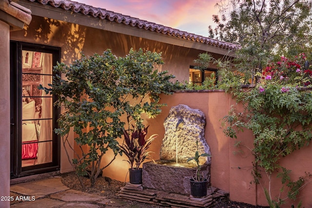 view of patio terrace at dusk