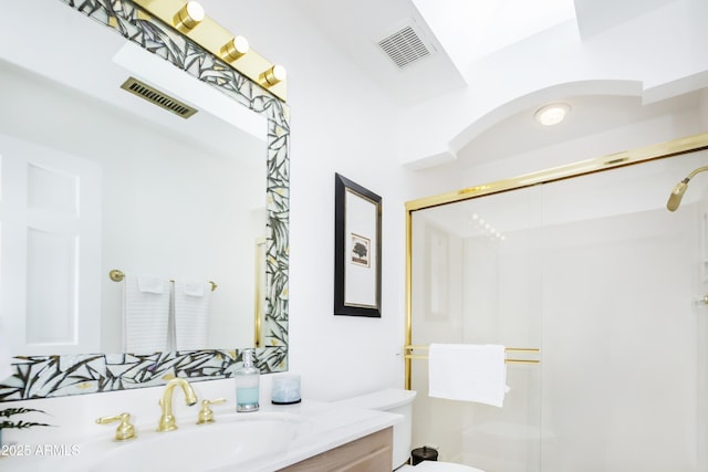 full bathroom featuring visible vents, toilet, and a shower stall