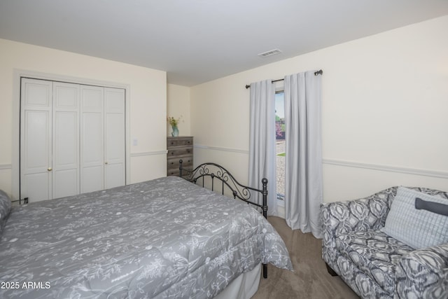 bedroom with visible vents and a closet