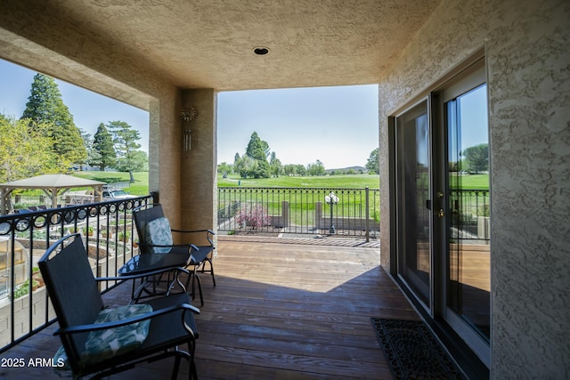 deck with golf course view