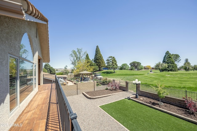 exterior space with a yard, a gazebo, and fence