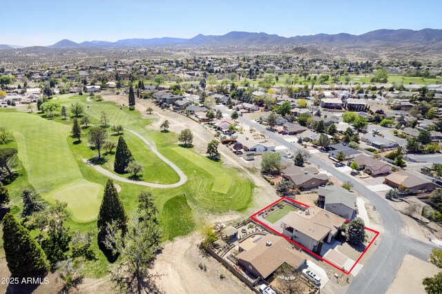 bird's eye view featuring a mountain view, golf course view, and a residential view