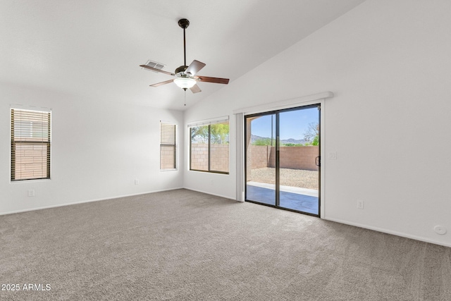empty room with baseboards, ceiling fan, carpet flooring, and visible vents