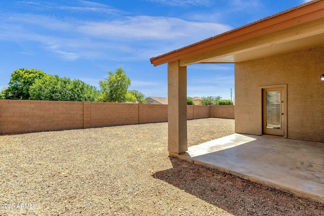 view of yard with a patio and a fenced backyard