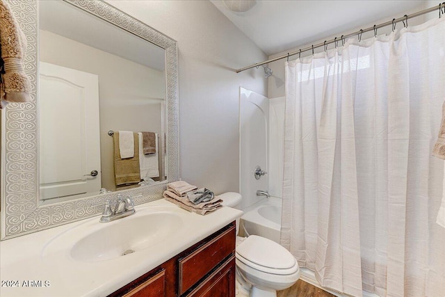 full bathroom featuring vanity, shower / tub combo with curtain, toilet, and hardwood / wood-style flooring