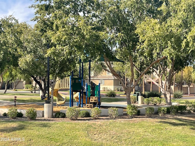 view of community with a yard and a playground