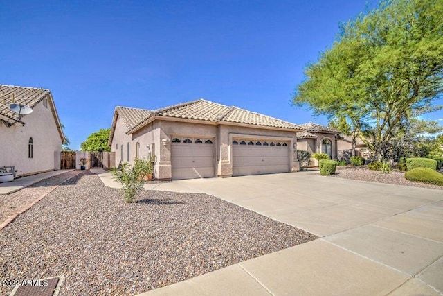 694 W Beechnut Dr, Chandler, AZ 85248 - mediterranean / spanish-style home with a tiled roof, a garage, concrete driveway, and stucco siding