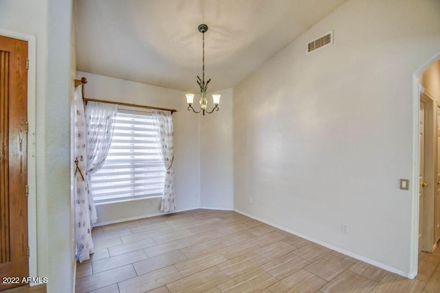 694 W Beechnut Dr, Chandler, AZ 85248 - unfurnished room featuring a chandelier and wood finished floors