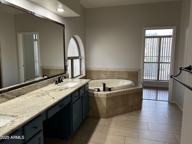 694 W Beechnut Dr, Chandler, AZ 85248 - bathroom with a garden tub, double vanity, and tile patterned flooring