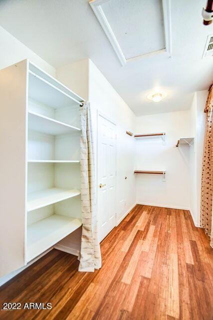 694 W Beechnut Dr, Chandler, AZ 85248 - spacious closet featuring wood finished floors