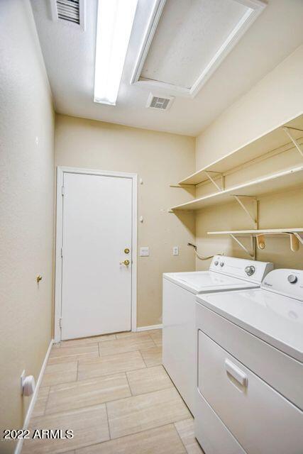 694 W Beechnut Dr, Chandler, AZ 85248 - laundry room featuring independent washer and dryer and baseboards