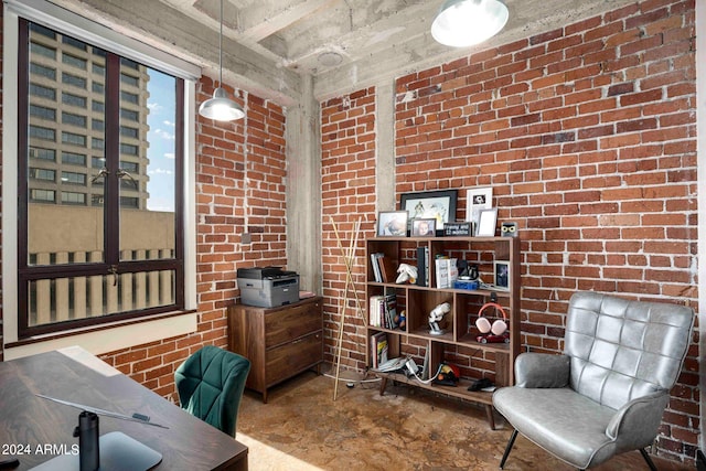 office featuring brick wall