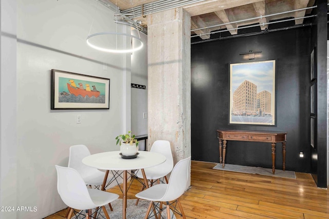 dining area with hardwood / wood-style flooring