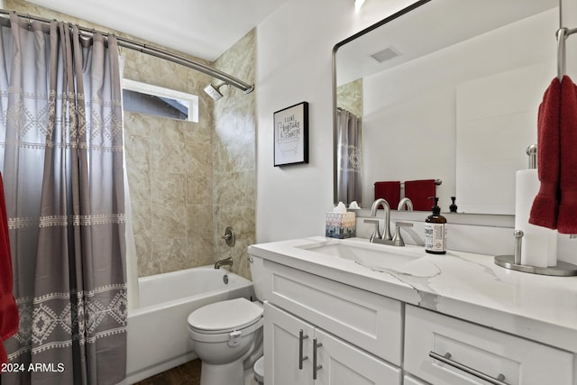 full bathroom with vanity, toilet, and shower / bath combo with shower curtain