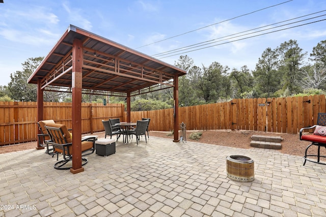 view of patio / terrace featuring a fire pit