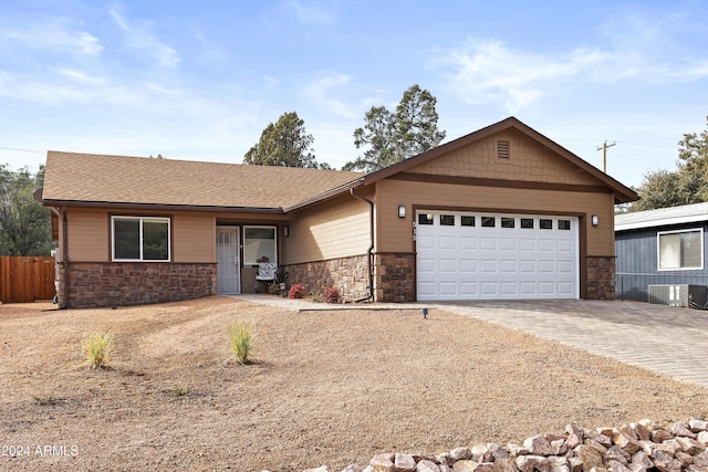 ranch-style home featuring a garage