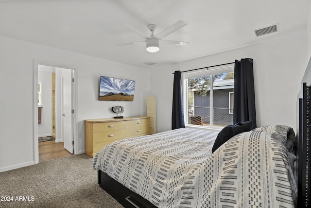 carpeted bedroom featuring ceiling fan and ensuite bathroom