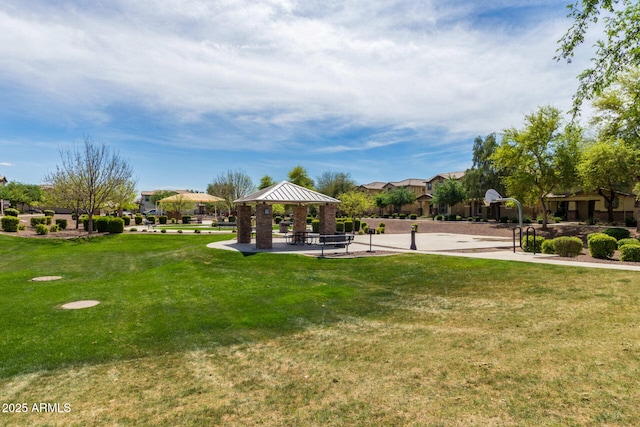 view of home's community with community basketball court, a lawn, and a gazebo