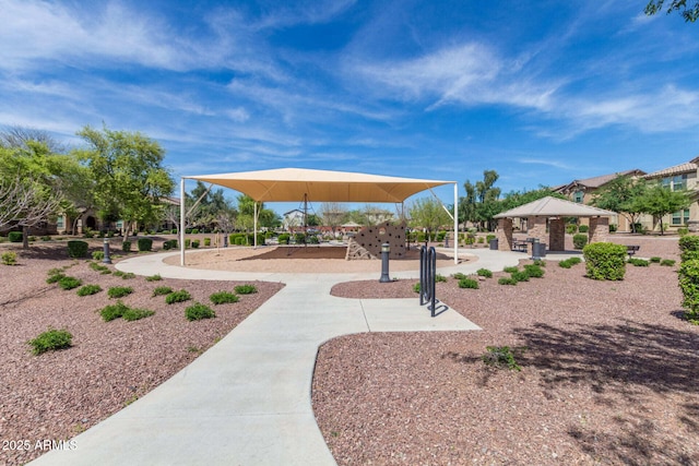 view of property's community featuring playground community and a gazebo