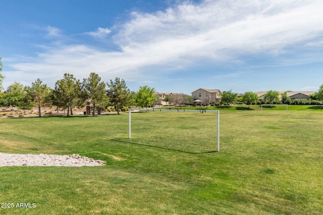 view of home's community featuring a yard