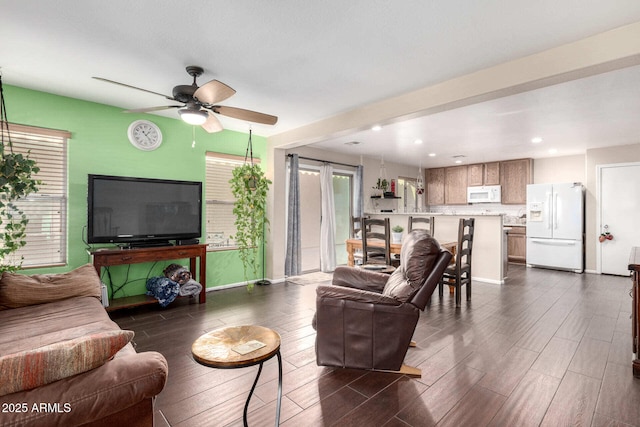 living room featuring ceiling fan, dark wood-type flooring, recessed lighting, and baseboards