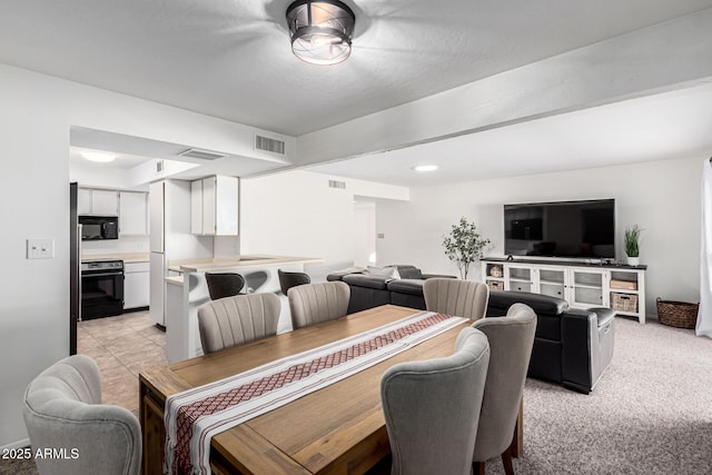 dining area with light carpet