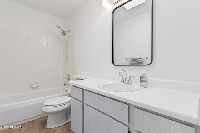 full bathroom featuring tile patterned floors, vanity, toilet, and shower / bath combination