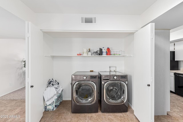 laundry room featuring separate washer and dryer