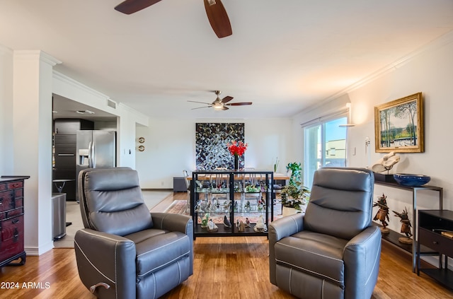 living room with hardwood / wood-style flooring and crown molding