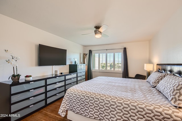 bedroom featuring dark hardwood / wood-style floors and ceiling fan