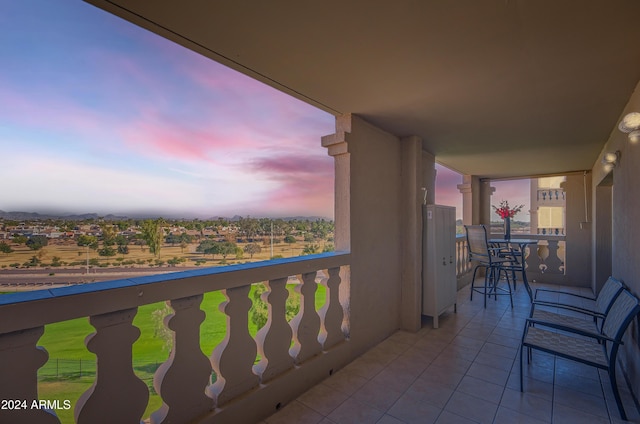 view of balcony at dusk