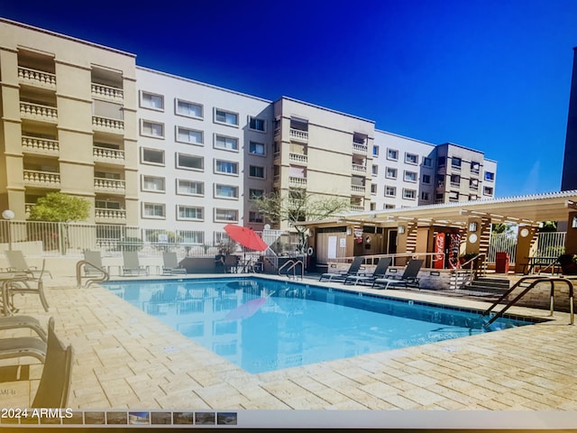 view of swimming pool with a patio area